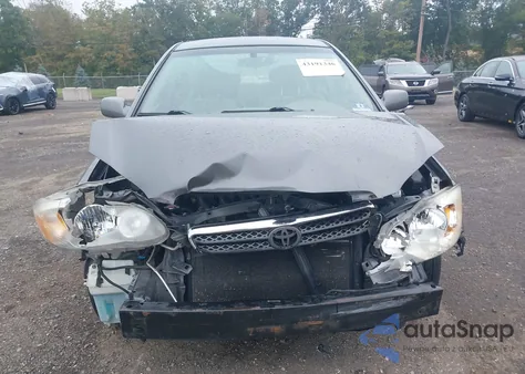 2005 Toyota Corolla Le z USA, uszkodzony, nr VIN 2T1BR30E85C360254